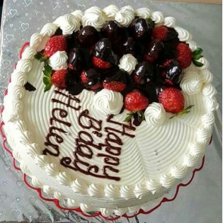 Birthday cake with fruit toppings